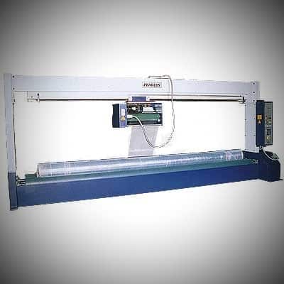 Fabric roll wrapping machine